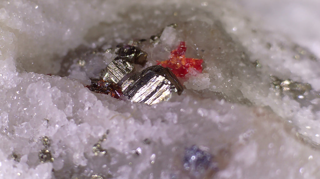 HUTCHINSONITE (brown in the front), REALGAR, SULFO and others (micro and miniature)