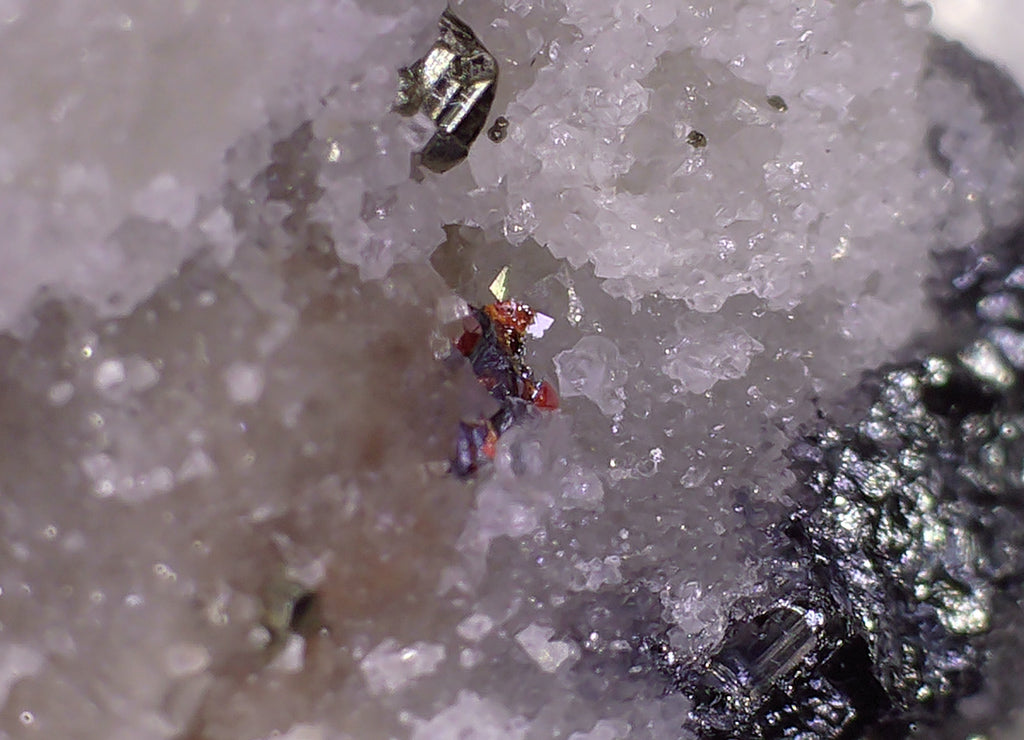 HUTCHINSONITE (brown in the front), REALGAR, SULFO and others (micro and miniature)