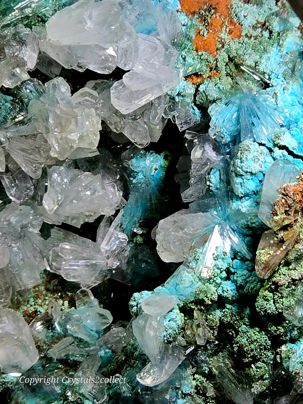 Clear quartz crystals with blue-green mineral matrix, natural geological specimen
