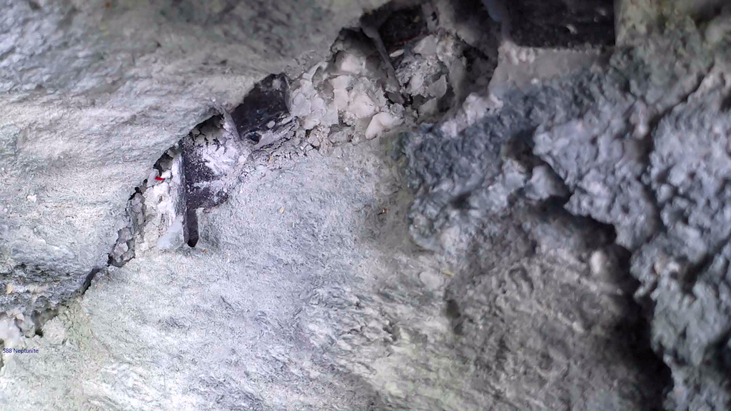 NEPTUNITE, JOAQUINITE, JONESITE (?) ON NATROLITE with SERPENTINE (small cabinet)