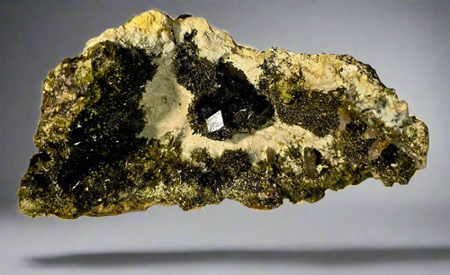 Pyrite on matrix from Spain, showcasing metallic crystals and earthy textures for mineral collectors