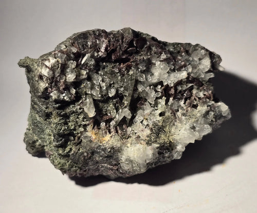 Fluorite with Quartz crystals from a classic locality, showcasing purple and clear mineral specimens for collectors.