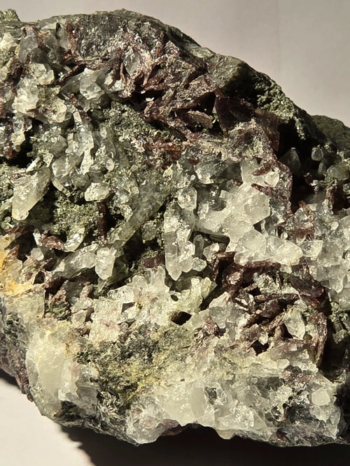 Calcite and Chalcopyrite mineral specimen from classic locality, featuring clear crystals and metallic luster on matrix.