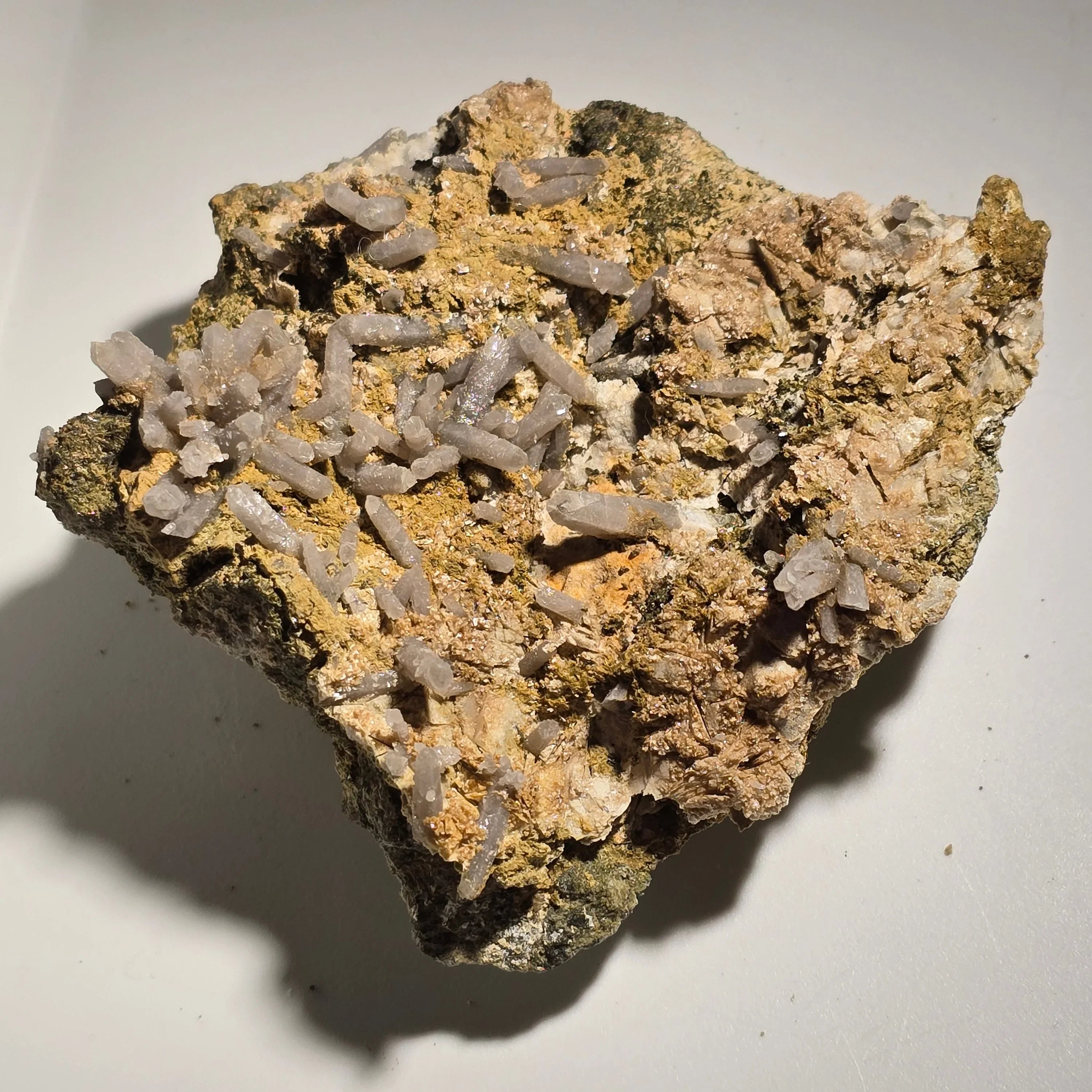 Stilbite mineral specimen with delicate white crystals on earthy matrix, ideal for collectors