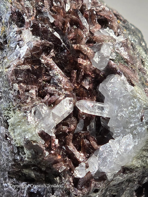 Clear quartz crystals with reddish-brown matrix, mineral specimen for collectors