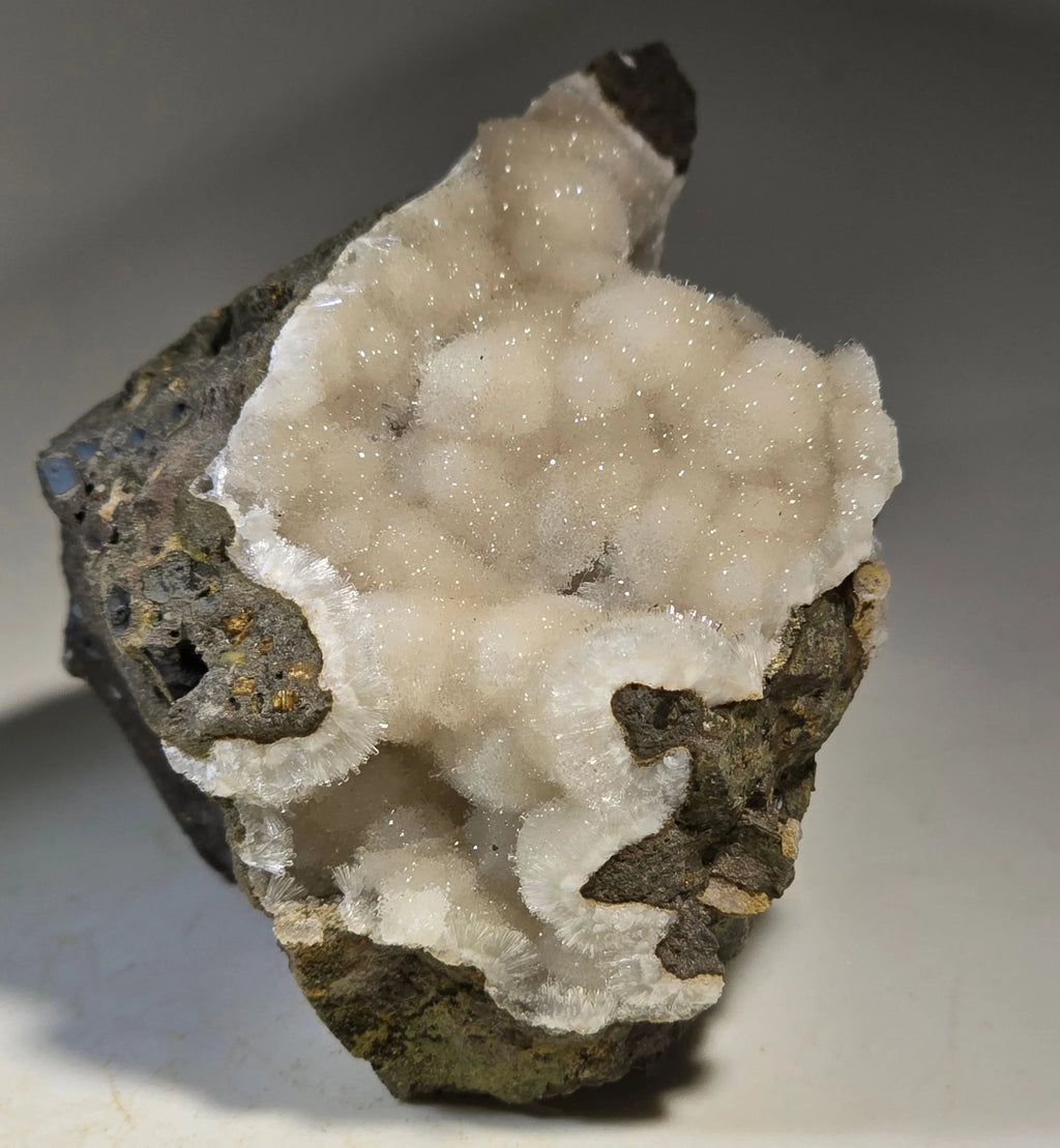 Calcite on matrix from classic locality, sparkling white crystals over dark rock, mineral specimen for collectors