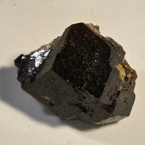 Magnetite crystal specimen with metallic luster, dark gray to black mineral, natural geological formation