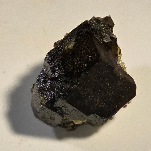 Fluorite crystal specimen with dark cubic formation and metallic luster, mineral collector's item