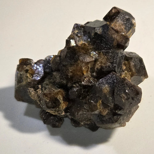 Fluorite crystal cluster with metallic luster, dark purple and brown hues, mineral specimen for collectors