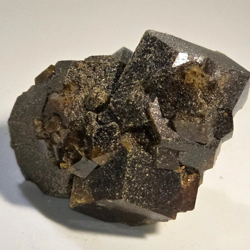 Magnetite crystal specimen with metallic luster and cubic formation, mineral collector's display piece