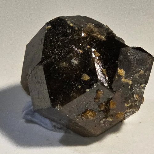 Fluorite crystal with golden inclusions, showcasing natural mineral specimen for collectors