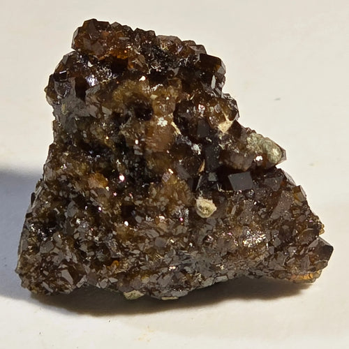 Andradite Garnet specimen with sharp, dark brown crystals on matrix, ideal for mineral collectors
