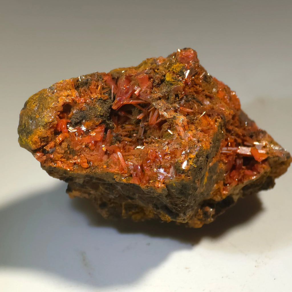 Crocoidite mineral specimen with vibrant red-orange crystals on matrix, classic locality specimen for collectors