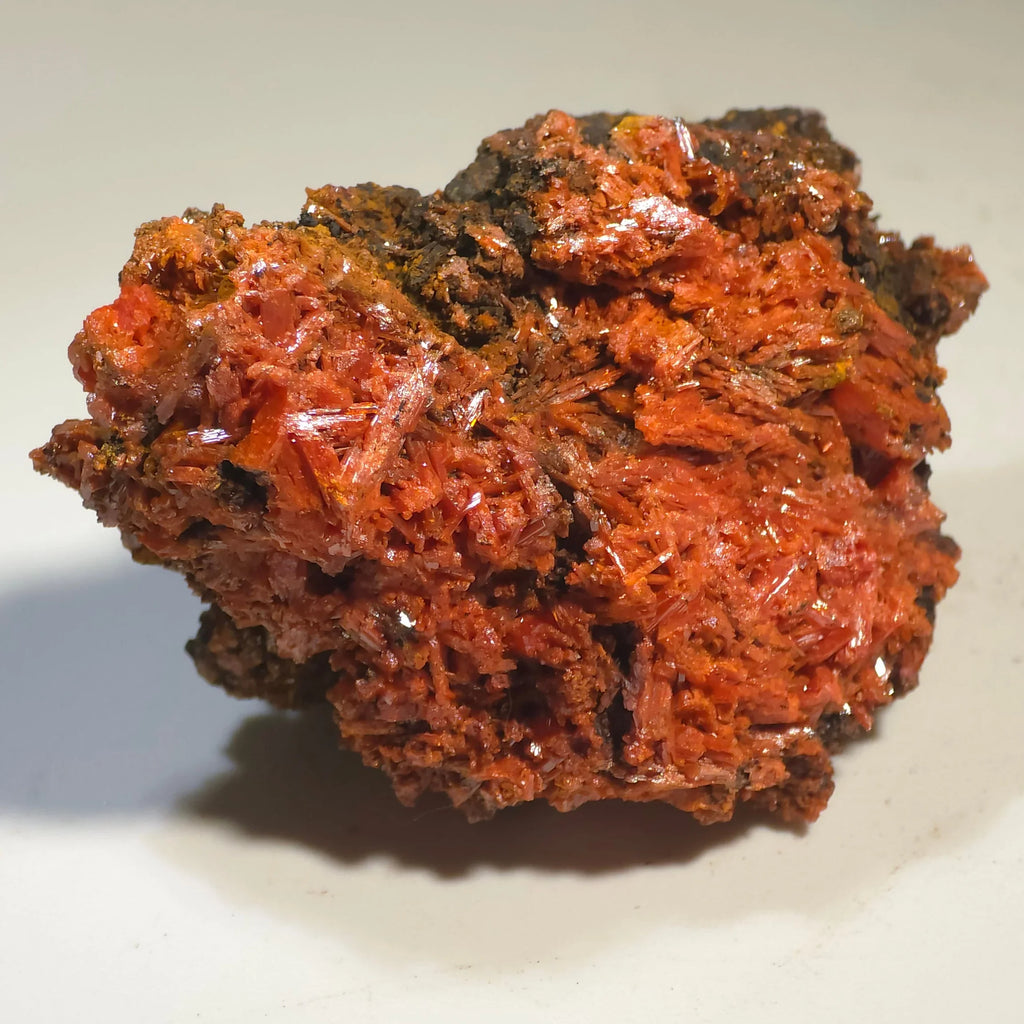 Crocoidite mineral specimen with vibrant red-orange crystals on dark matrix, ideal for collectors