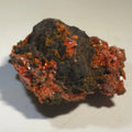 Cinnabar mineral specimen with vibrant red crystals on dark matrix, classic locality specimen for collectors