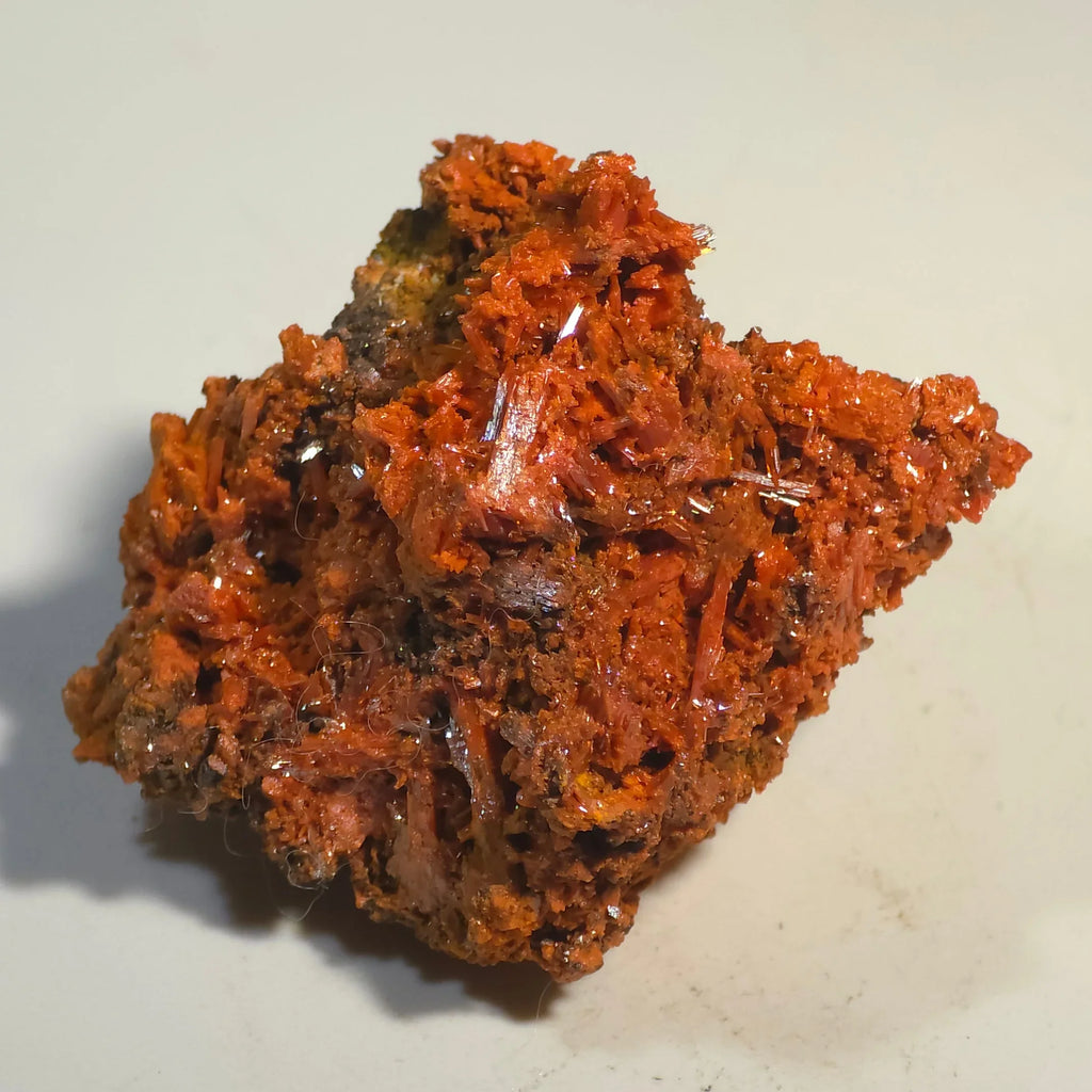 Crocoidite mineral specimen with vibrant red-orange crystal clusters on matrix, ideal for collectors