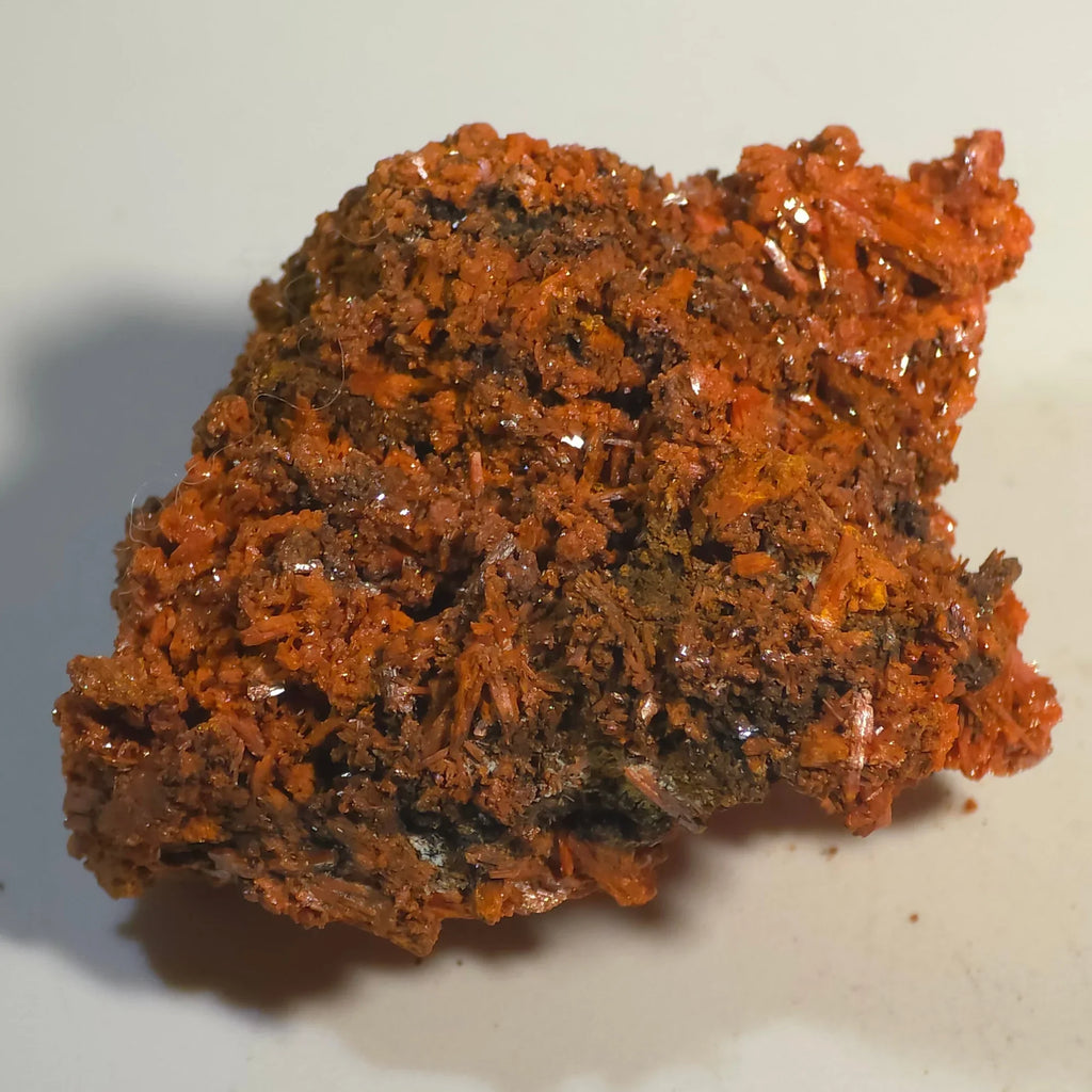 Crocoidite mineral specimen with vibrant red-orange crystals on dark matrix, classic locality specimen