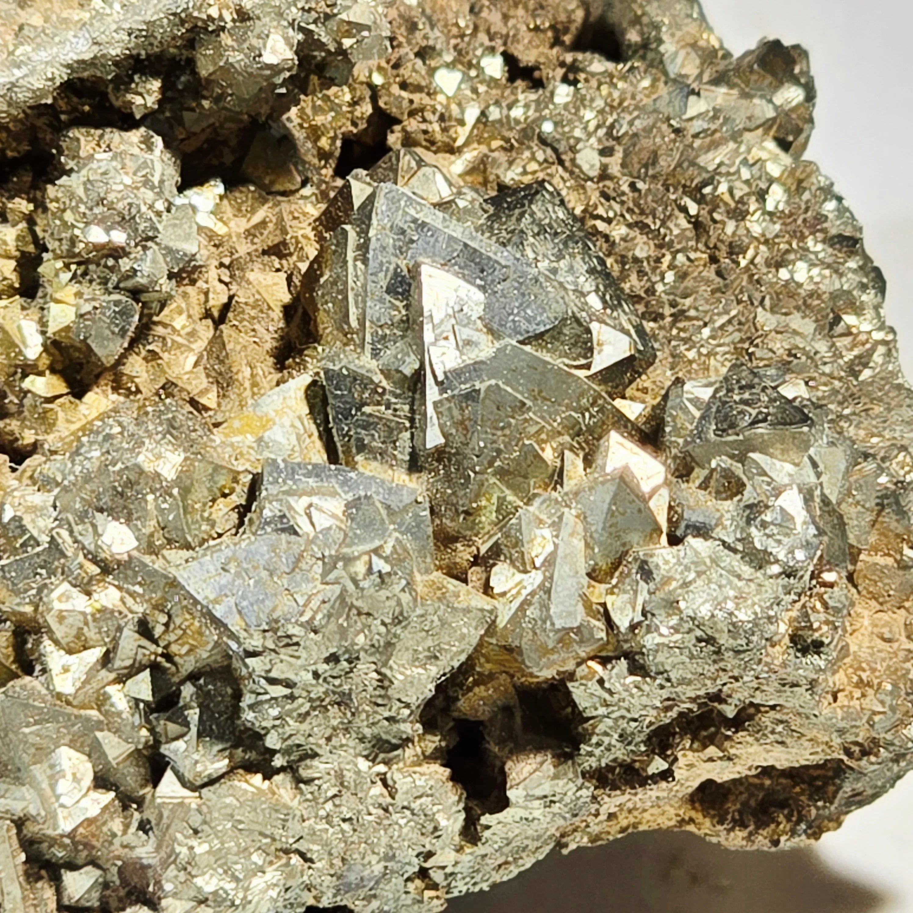 Pyrite crystals with metallic luster on matrix, mineral specimen for collectors