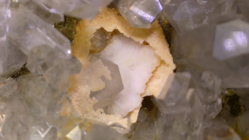 Quartz crystal cluster with golden matrix, showcasing clear terminated points and natural mineral formation