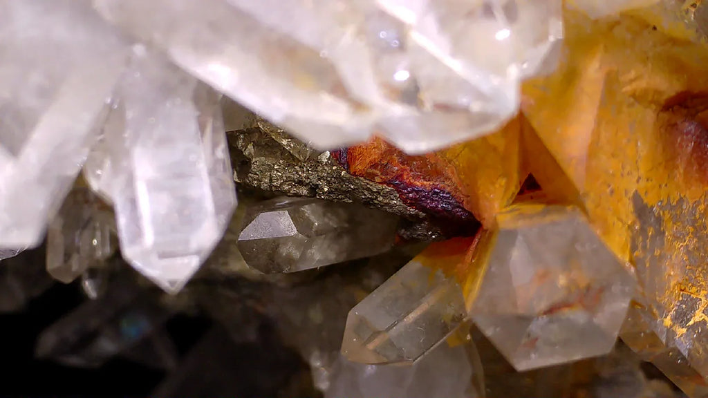 Quartz crystals with iron oxide staining, clear mineral specimens from classic locality