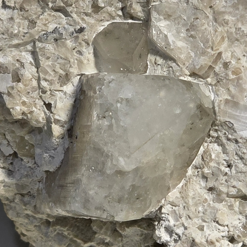 Fluorite crystal specimen with cubic form, embedded in matrix, showcasing natural mineral formation