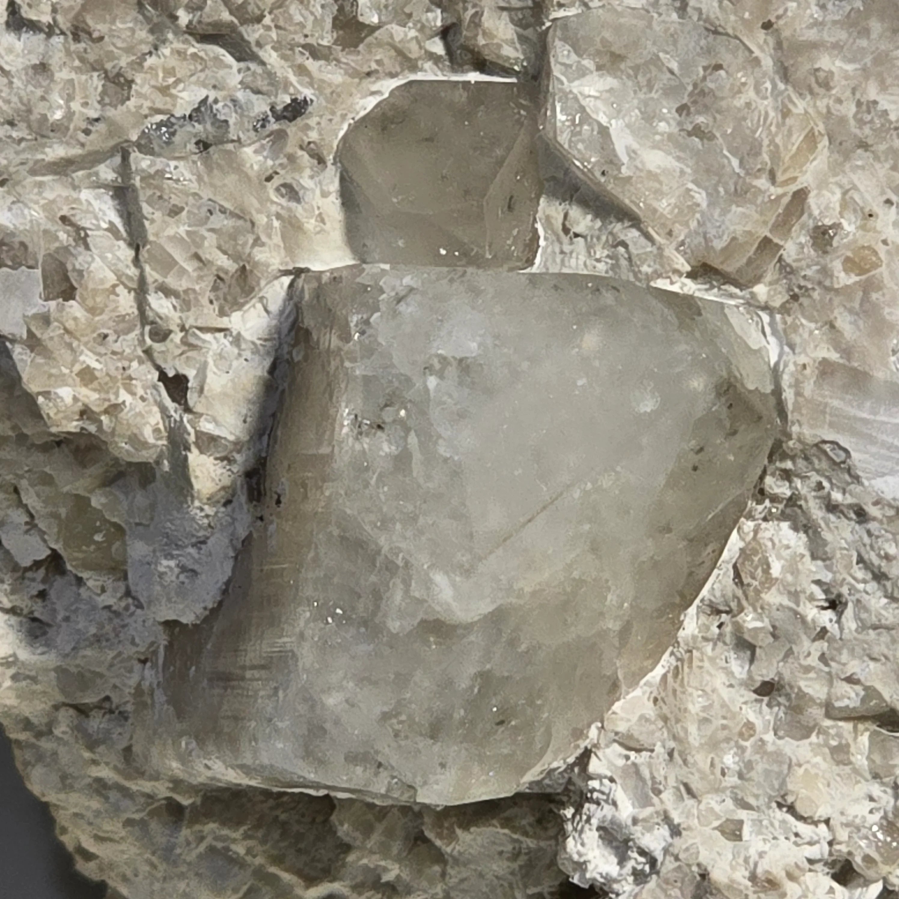 Fluorite crystal specimen with cubic form, embedded in matrix, showcasing natural mineral formation