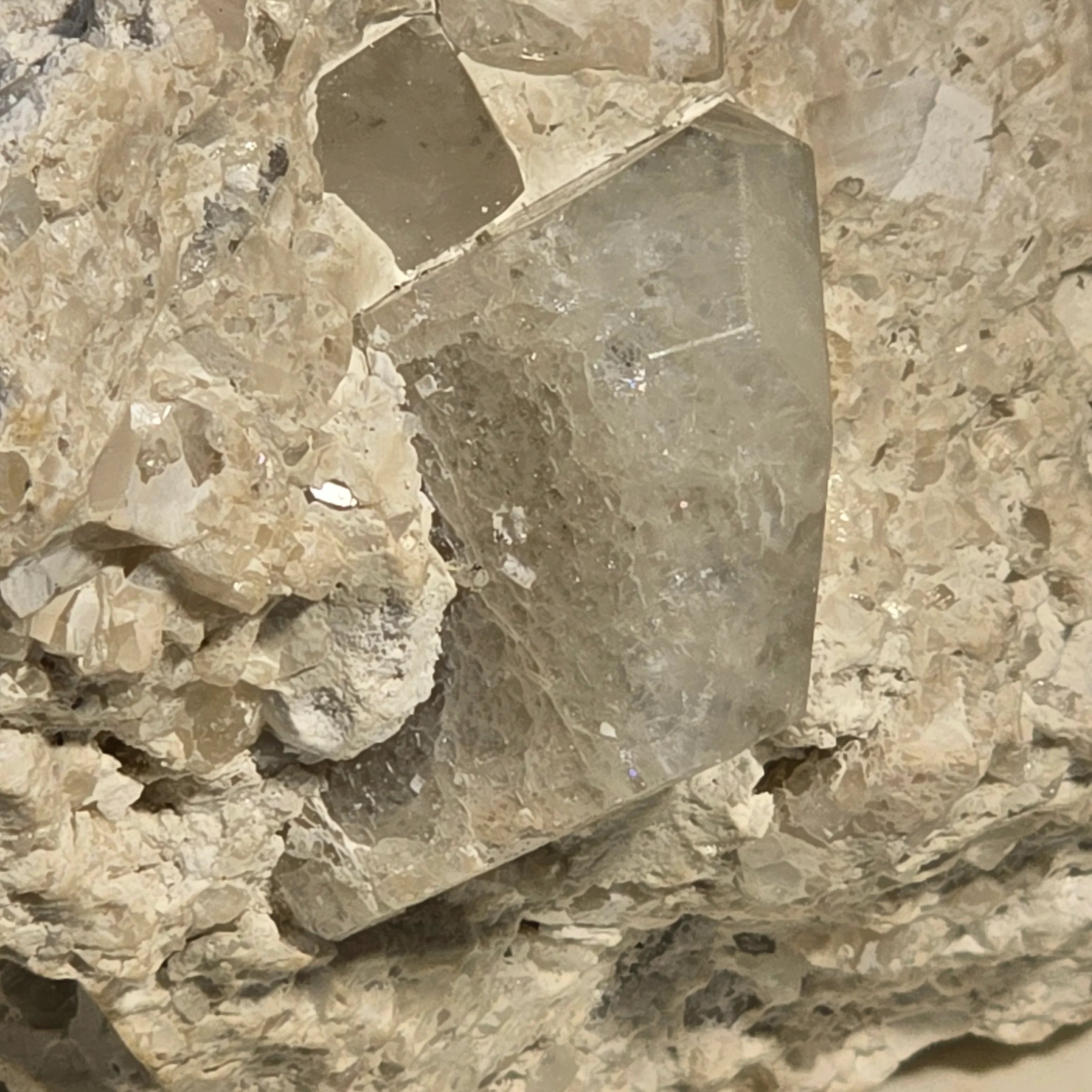 Fluorite crystal specimen with cubic formation, embedded in matrix, showcasing natural mineral texture and clarity