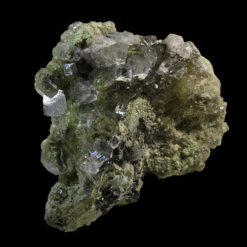 Fluorite crystal cluster on green matrix, showcasing clear cubic crystals and earthy texture