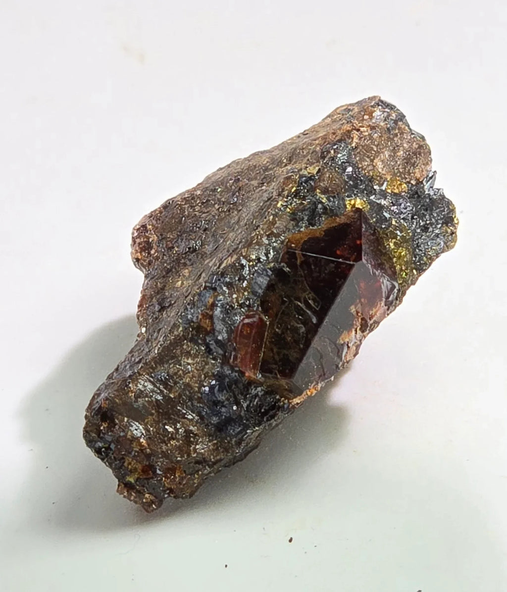 Andradite Garnet crystal on matrix from Russia, deep red gemstone with metallic inclusions
