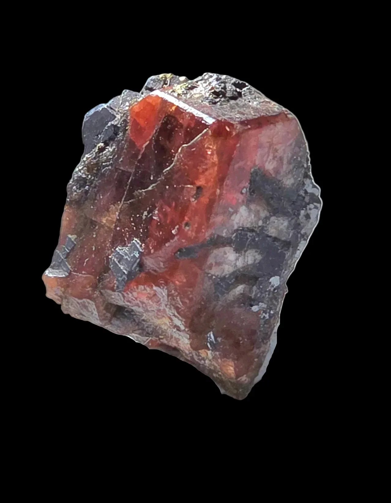 Spessartine Garnet crystal with metallic inclusions, rough mineral specimen on black background