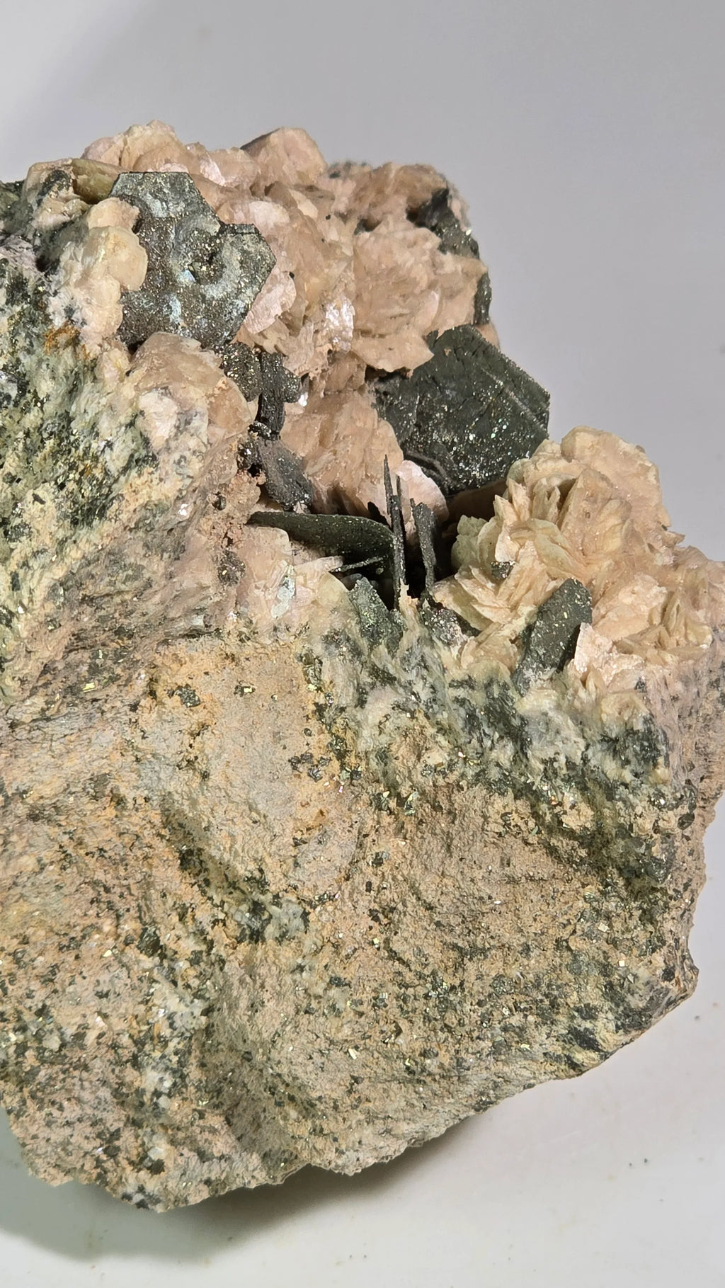 Magnetite crystals on pink mica matrix, mineral specimen for collectors