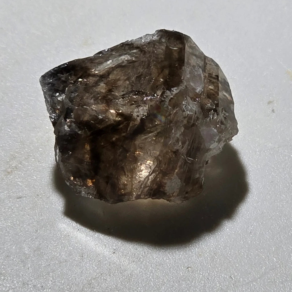 Smoky Quartz crystal specimen with natural facets and earthy tones, ideal for mineral collectors