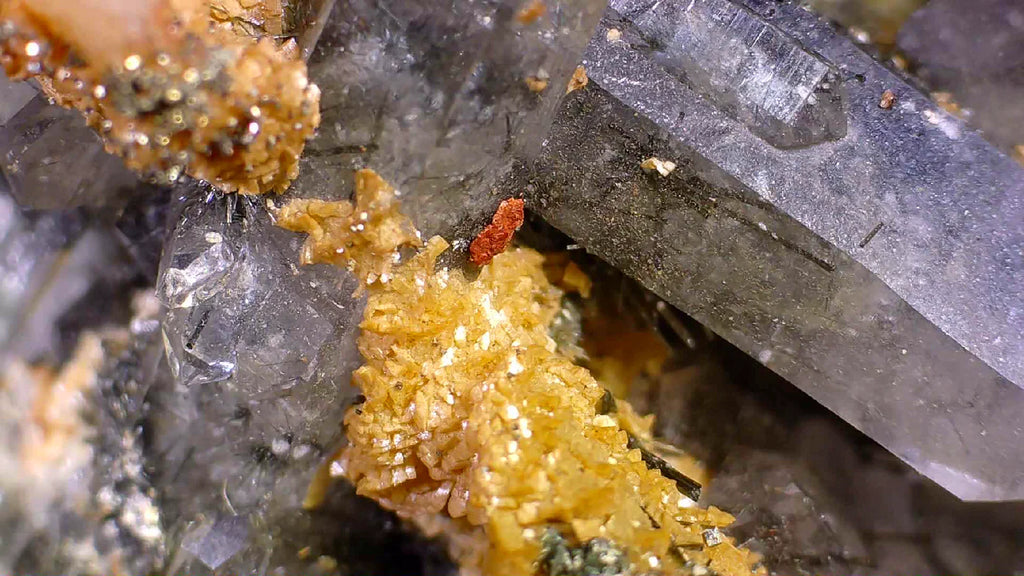 Quartz with golden calcite and red mineral inclusions, classic mineral specimen