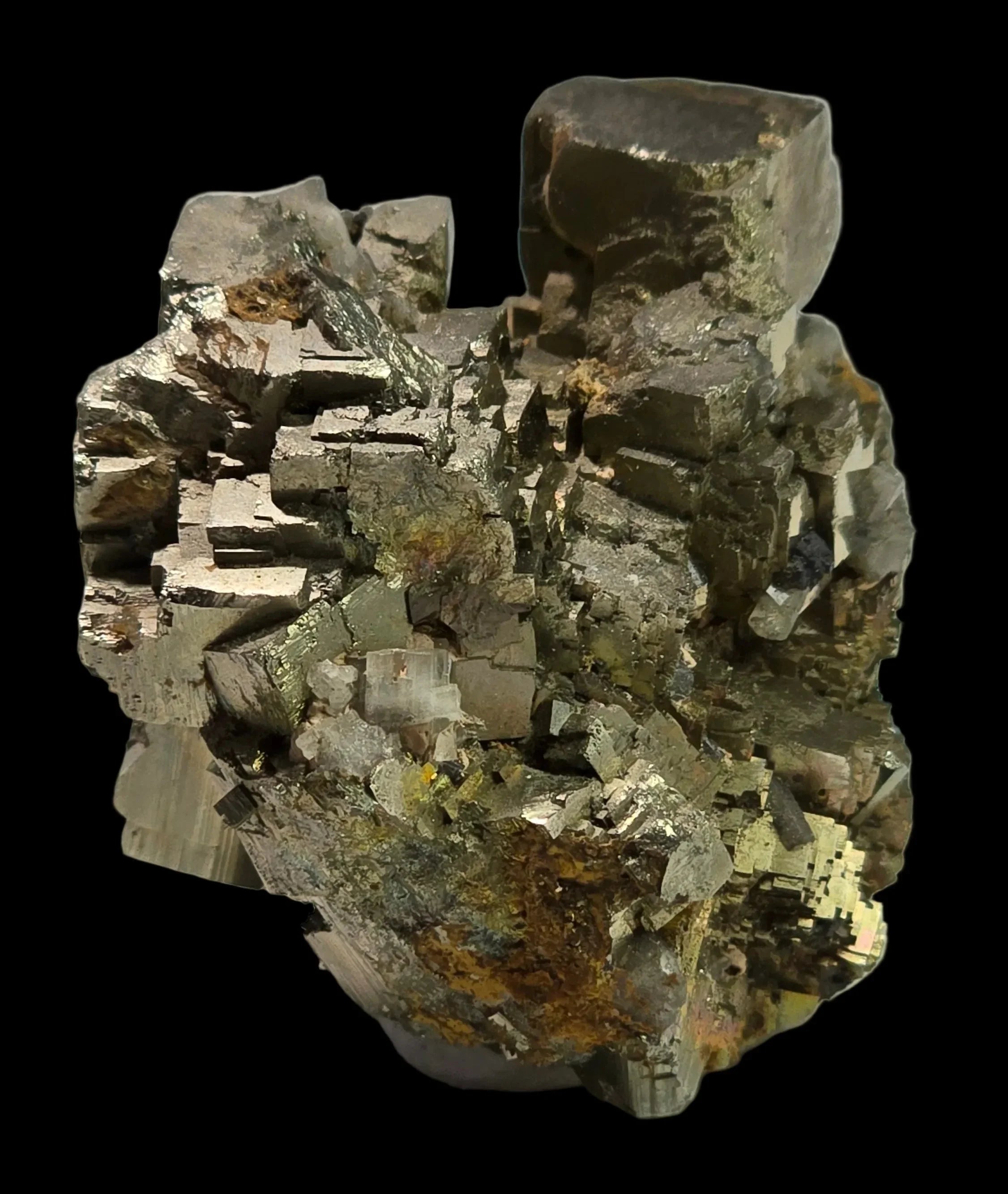 Pyrite crystal cluster with metallic luster, cubic formations, and earthy matrix on black background