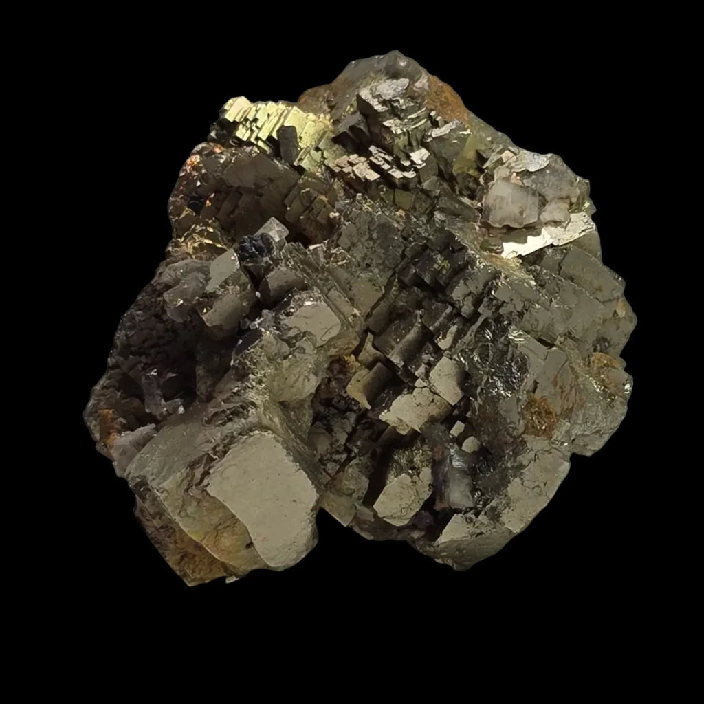 Pyrite crystal cluster with cubic formations, metallic luster, and earthy matrix against black background