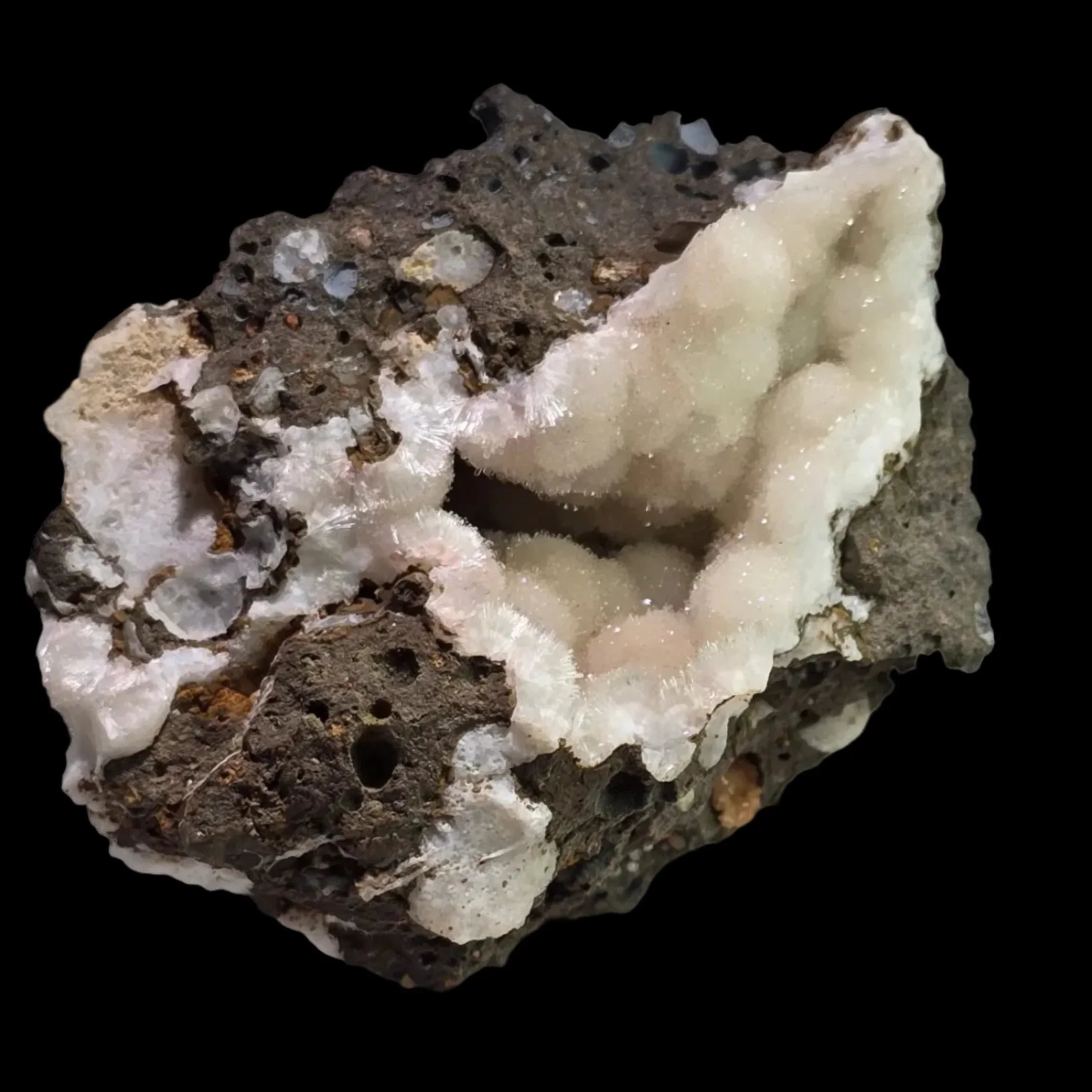 Heulandite on Basalt, white feathery crystals on dark volcanic rock matrix