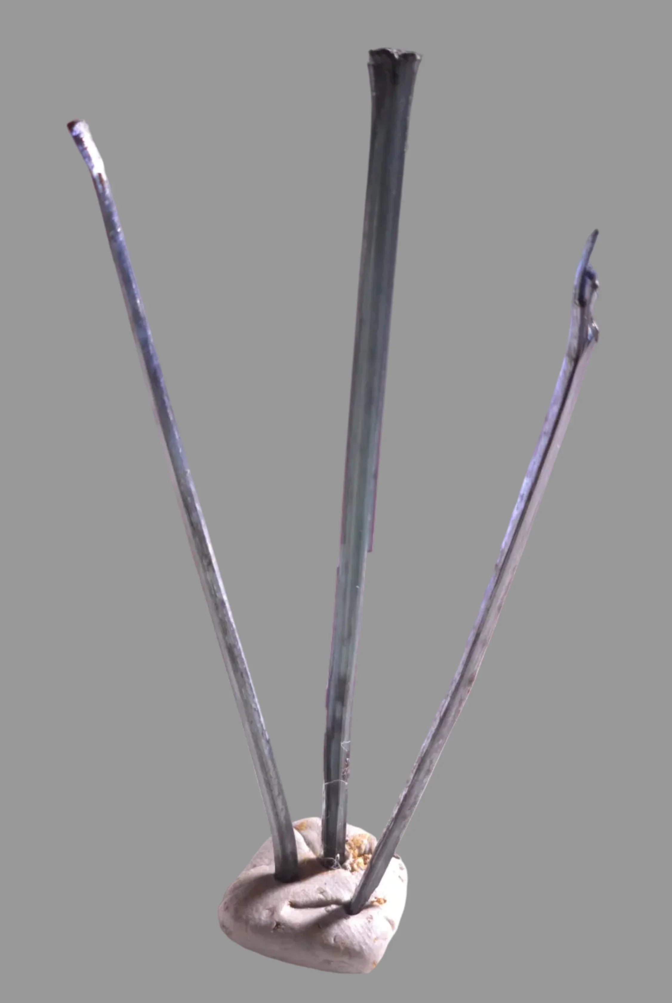 Stibnite mineral specimen with metallic luster, three elongated crystals on matrix, classic locality example