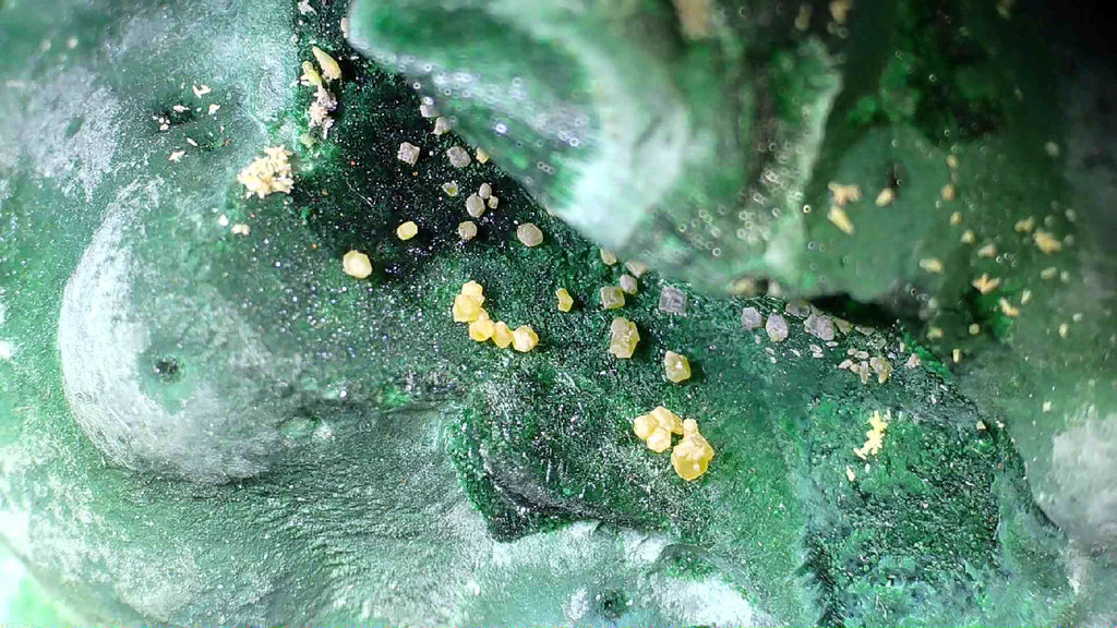 Malachite with yellow crystals, classic mineral specimen for collectors