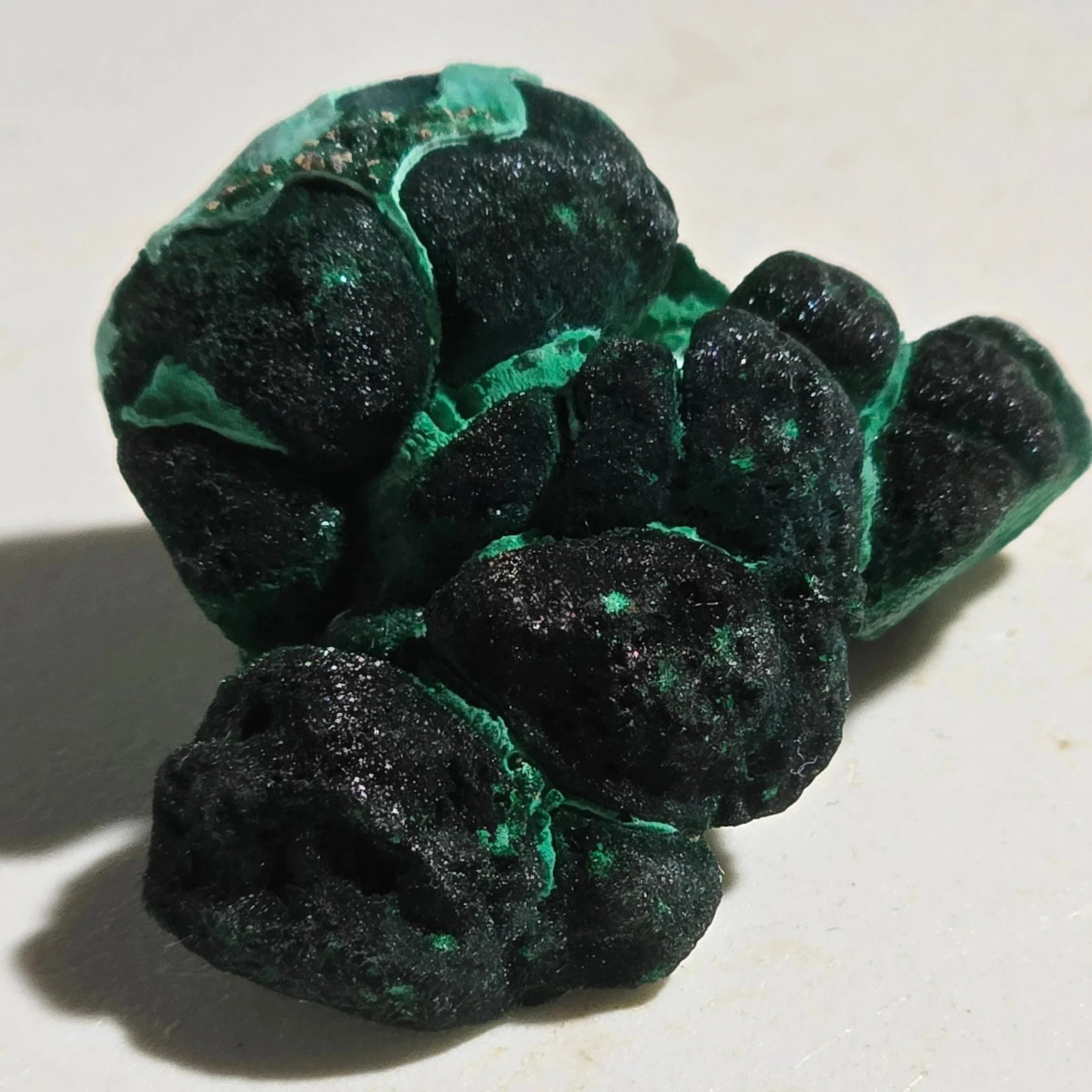 Malachite mineral specimen with vibrant green botryoidal formations, ideal for collectors and geological study.