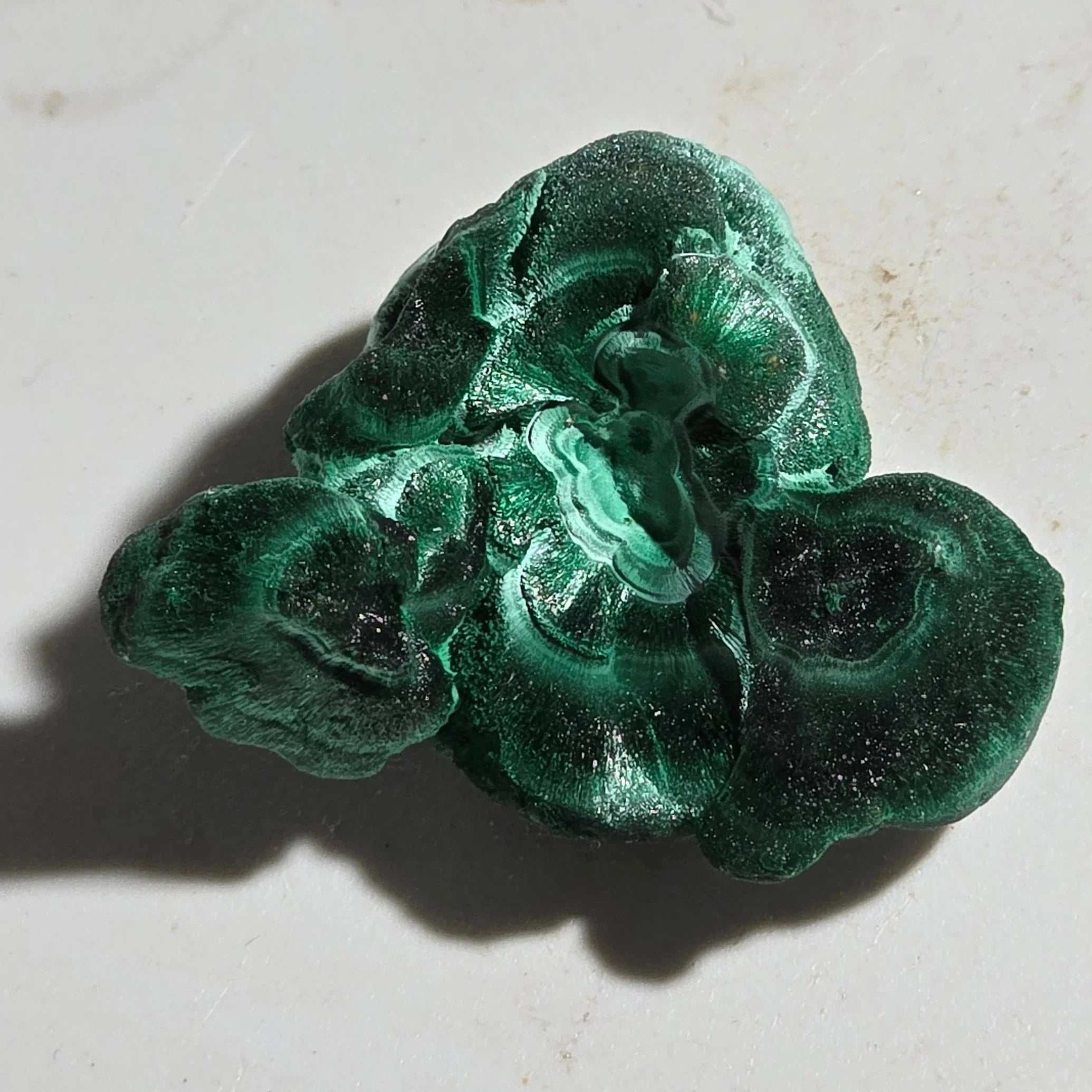 Malachite mineral specimen with vibrant green botryoidal formations, natural crystal texture