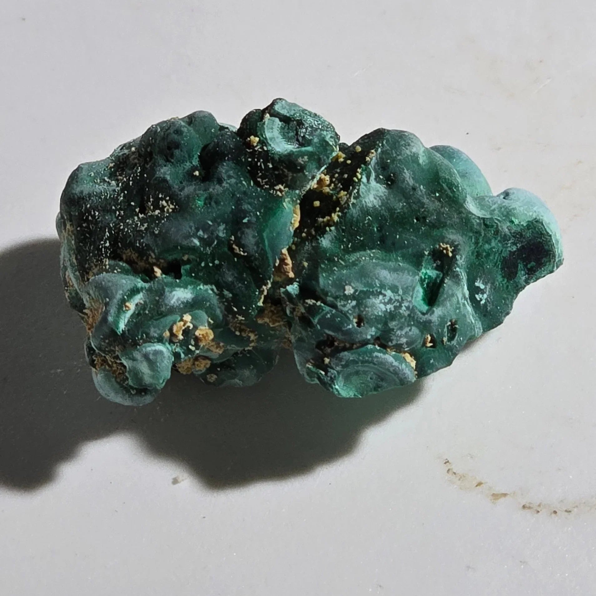 Malachite mineral specimen with vibrant green botryoidal formations, natural crystal texture