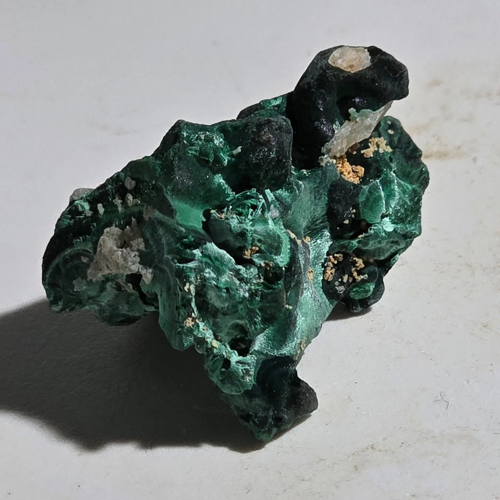 Malachite mineral specimen with vibrant green botryoidal formations and matrix, ideal for collectors
