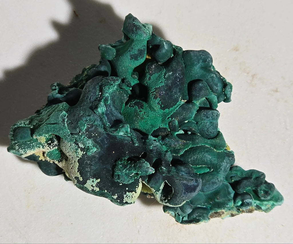 Malachite mineral specimen with vibrant green botryoidal formations, natural crystal collectible