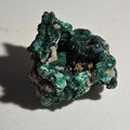Malachite mineral specimen with vibrant green botryoidal formations, natural crystal cluster