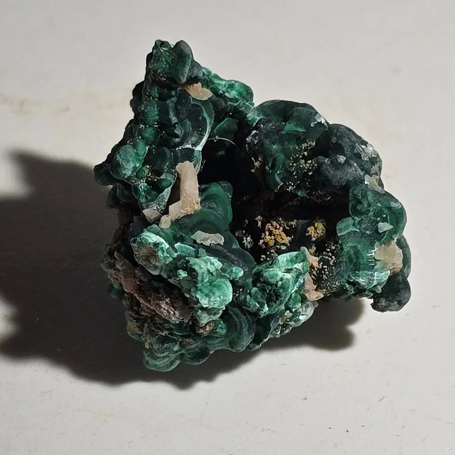 Malachite mineral specimen with vibrant green botryoidal formations, natural crystal cluster