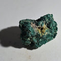Malachite mineral specimen with vibrant green texture and yellow inclusions, natural crystal formation