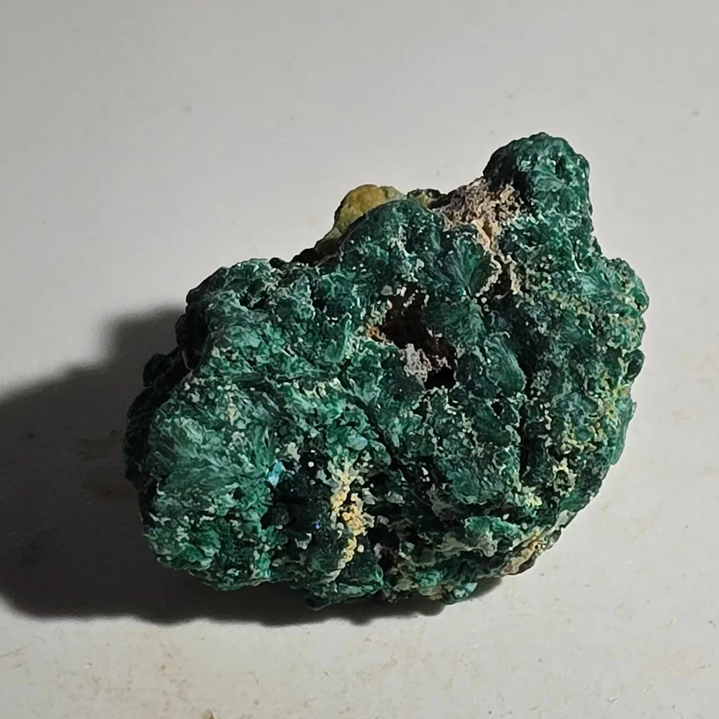 Malachite mineral specimen with vibrant green botryoidal texture, natural rough crystal formation