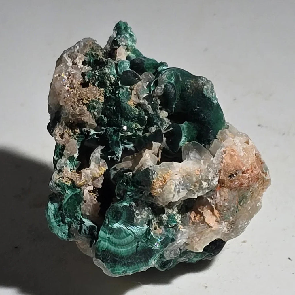 Malachite specimen with vibrant green bands and matrix, mineral collector's piece