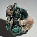 Malachite specimen with vibrant green bands and matrix, mineral collector's piece