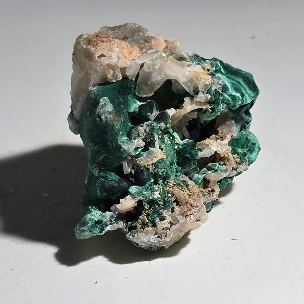 Malachite with quartz matrix, vibrant green botryoidal formations on white host rock